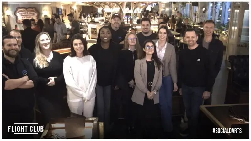 Expansive team photo from recent outing to Flight Club Darts in London